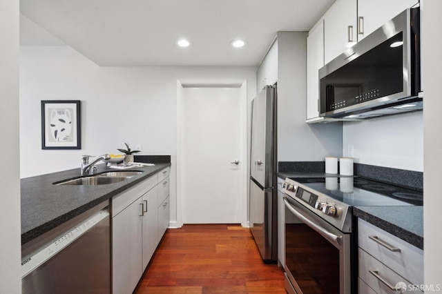 451 Kansas St Unit 428, San Francisco, CA 94107 - kitchen featuring stainless steel appliances, dark wood-type flooring, recessed lighting, and white cabinets
