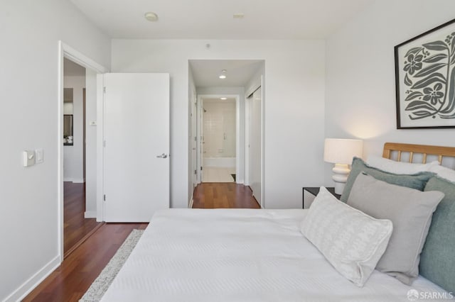 451 Kansas St Unit 428, San Francisco, CA 94107 - bedroom with wood finished floors, connected bathroom, and recessed lighting