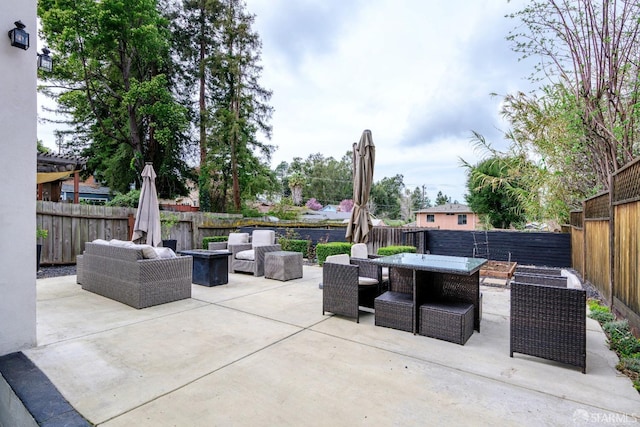 view of patio with outdoor lounge area and a fenced backyard