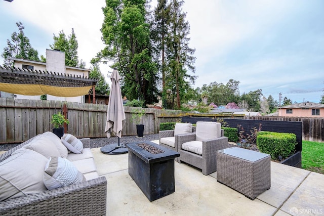 view of patio featuring a fenced backyard, a pergola, and an outdoor living space with a fire pit