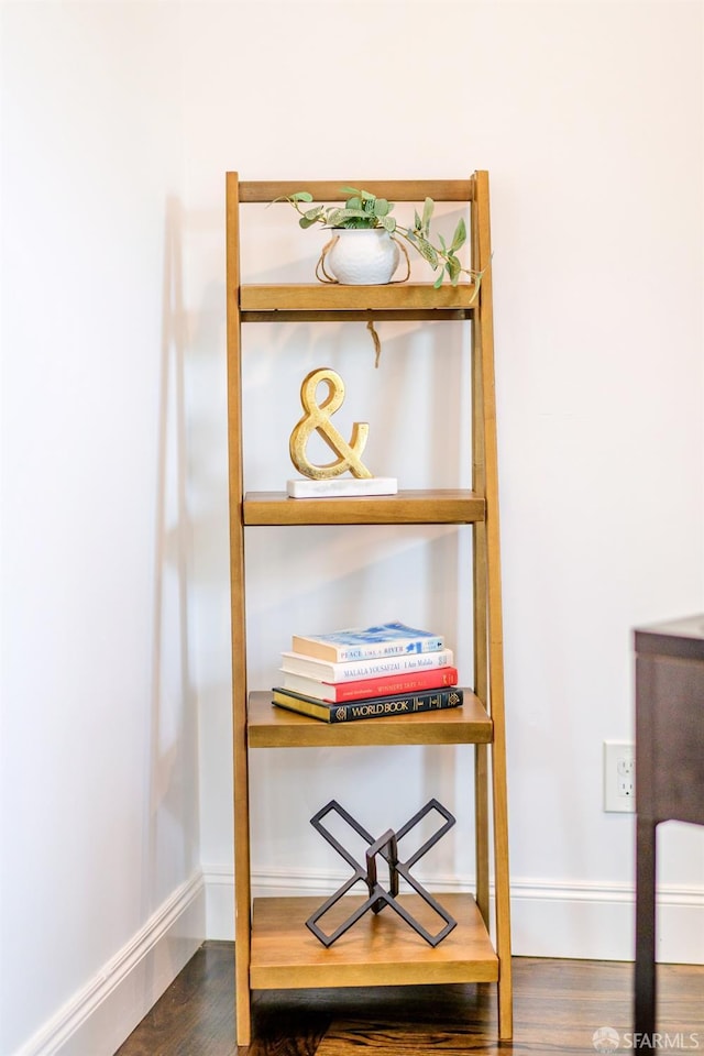 details featuring wood finished floors and baseboards