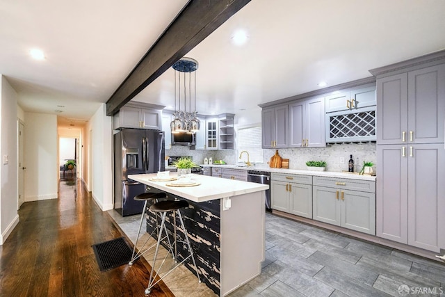 kitchen featuring appliances with stainless steel finishes and gray cabinets