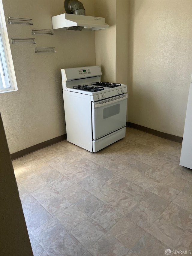 kitchen with range hood and white gas stove