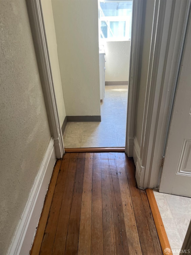 corridor featuring hardwood / wood-style flooring