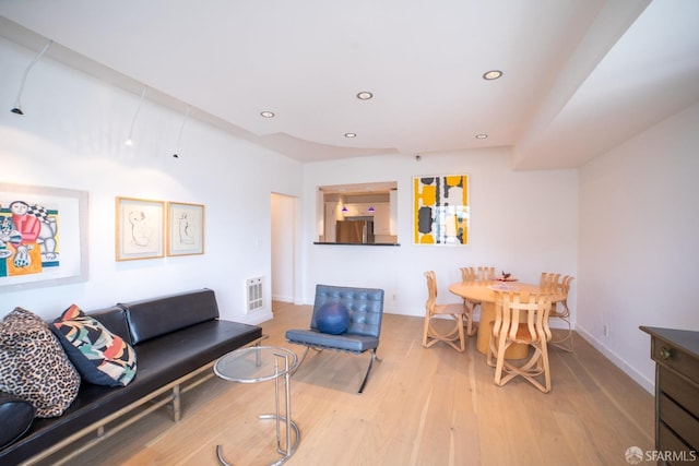 living room with light hardwood / wood-style floors