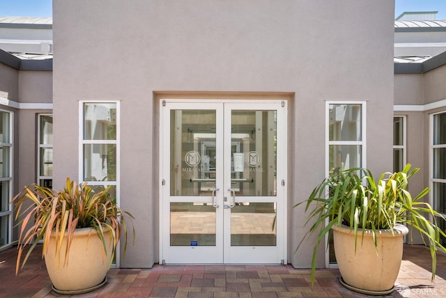 3901 Lick Mill Blvd Unit 165, Santa Clara, CA 95054 - doorway to property with french doors, a standing seam roof, stucco siding, and metal roof