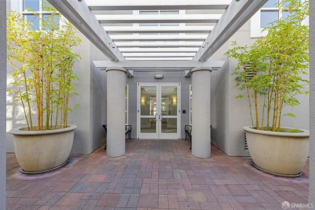 3901 Lick Mill Blvd Unit 165, Santa Clara, CA 95054 - doorway to property featuring french doors, stucco siding, and a pergola