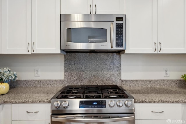 3901 Lick Mill Blvd Unit 165, Santa Clara, CA 95054 - kitchen with appliances with stainless steel finishes, white cabinetry, and tasteful backsplash