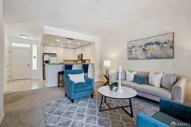 3901 Lick Mill Blvd Unit 165, Santa Clara, CA 95054 - living room featuring light carpet, light tile patterned floors, and baseboards