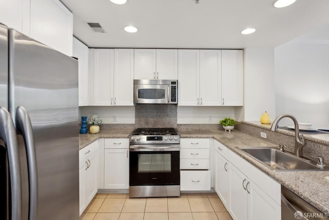 3901 Lick Mill Blvd Unit 165, Santa Clara, CA 95054 - kitchen with stainless steel appliances, a sink, white cabinetry, light tile patterned floors, and recessed lighting