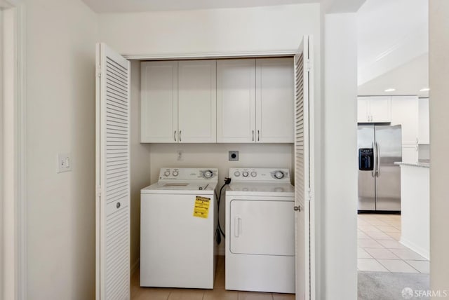 3901 Lick Mill Blvd Unit 165, Santa Clara, CA 95054 - washroom with cabinet space, washing machine and dryer, and light tile patterned flooring