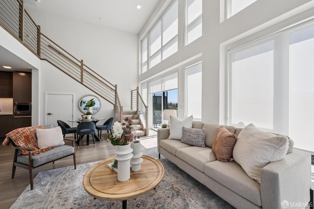 1605 Riviera Ave Unit 608, Walnut Creek, CA 94596 - living room with a towering ceiling, stairs, wood finished floors, and recessed lighting