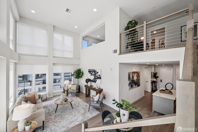 1605 Riviera Ave Unit 608, Walnut Creek, CA 94596 - living room with healthy amount of natural light, wood finished floors, and a towering ceiling