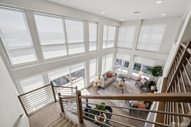 1605 Riviera Ave Unit 608, Walnut Creek, CA 94596 - carpeted living area featuring a high ceiling
