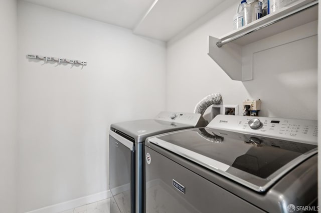 1605 Riviera Ave Unit 608, Walnut Creek, CA 94596 - laundry room featuring washing machine and dryer and light marble finish flooring