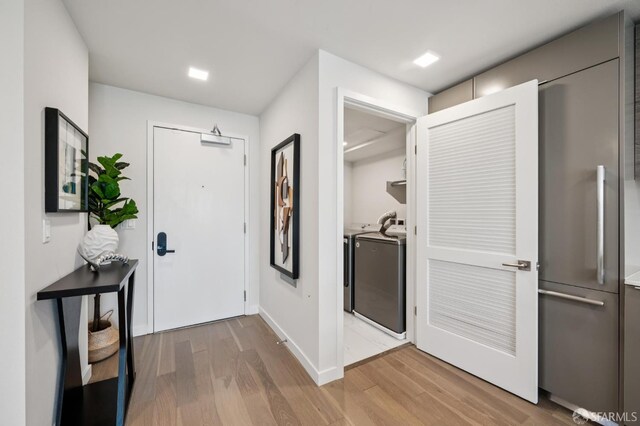 1605 Riviera Ave Unit 608, Walnut Creek, CA 94596 - entrance foyer with washer and dryer and wood finished floors