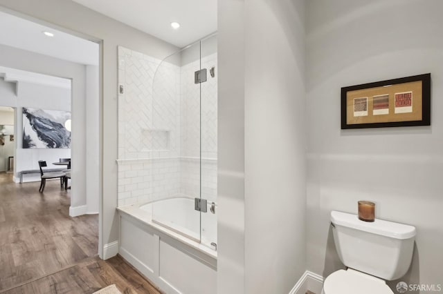 full bathroom featuring toilet, recessed lighting, shower / bath combination with glass door, wood finished floors, and baseboards