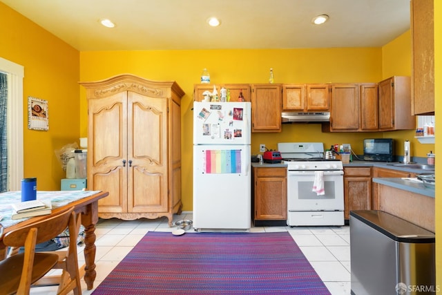 kitchen with recessed lighting, light tile patterned flooring, a sink, white appliances, and under cabinet range hood