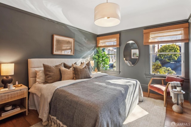 bedroom with hardwood / wood-style floors