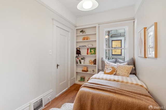 bedroom with light wood-type flooring