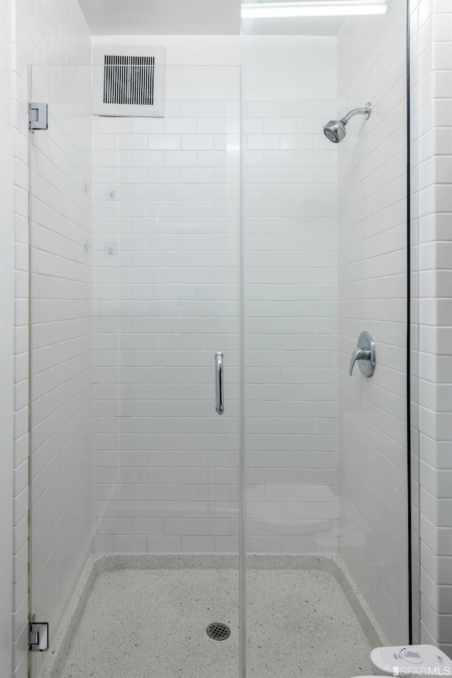 full bath featuring visible vents and a stall shower