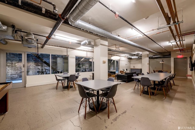 dining room with concrete flooring