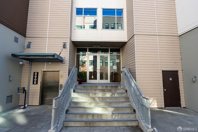 entrance to property with french doors and elevator