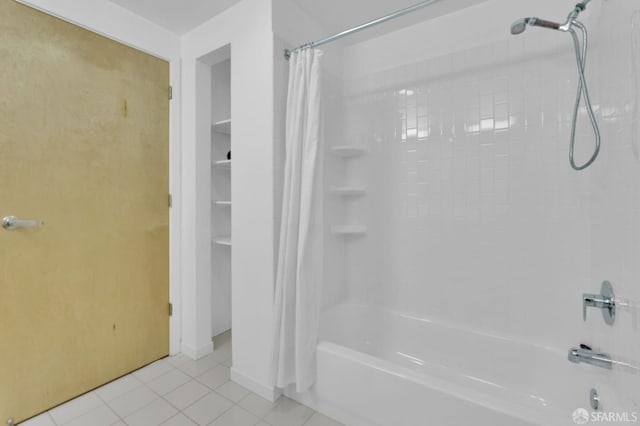 bathroom featuring tile patterned flooring and shower / bath combo with shower curtain