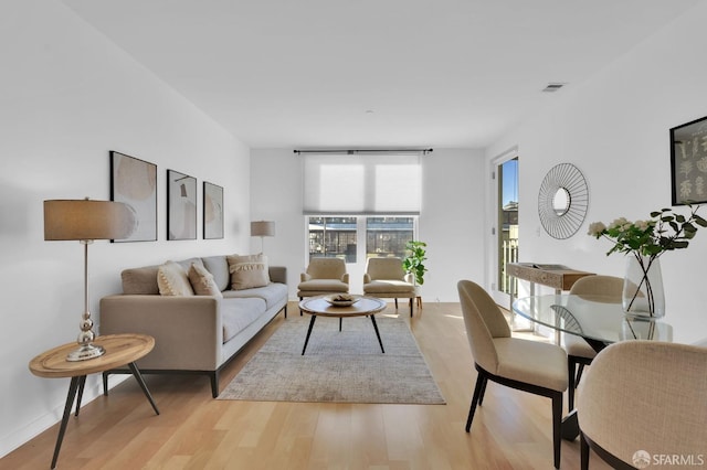 living room with light hardwood / wood-style floors