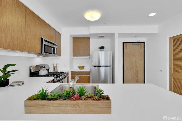 kitchen with sink and stainless steel appliances