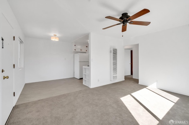 5020 Clarke St, Oakland, CA 94609 - unfurnished bedroom with freestanding refrigerator, carpet flooring, and a heating unit