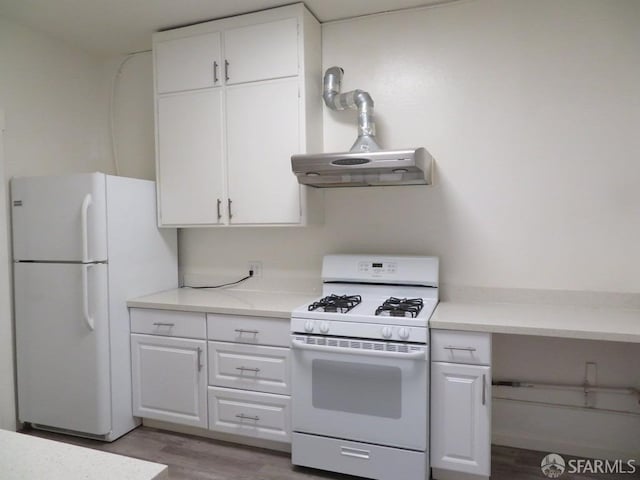 5020 Clarke St, Oakland, CA 94609 - kitchen with under cabinet range hood, white appliances, wood finished floors, and white cabinetry