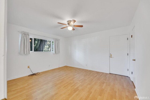 5020 Clarke St, Oakland, CA 94609 - unfurnished room with light wood-type flooring, baseboards, and ceiling fan
