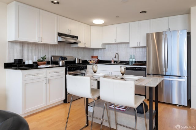 kitchen featuring white cabinetry, stainless steel appliances, and sink