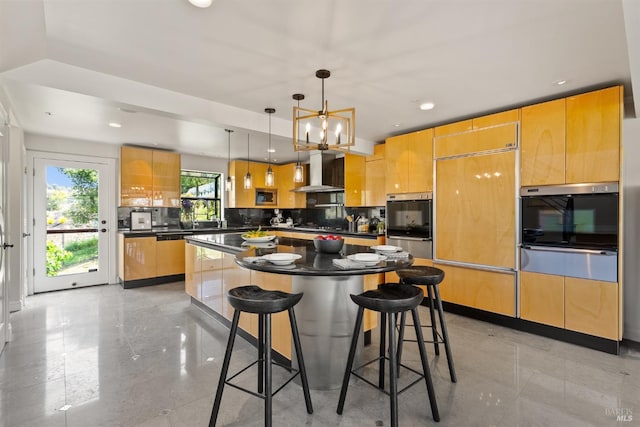 kitchen featuring wall chimney exhaust hood, a warming drawer, dark countertops, and oven