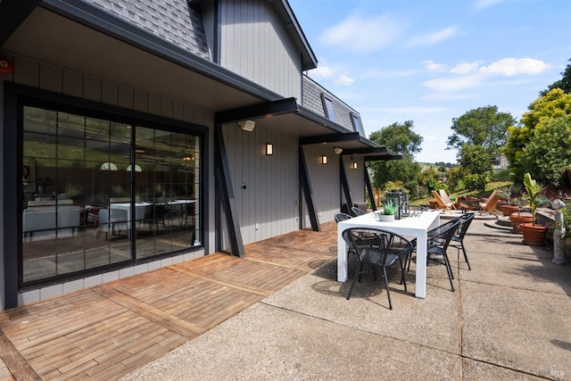 view of patio featuring outdoor dining area