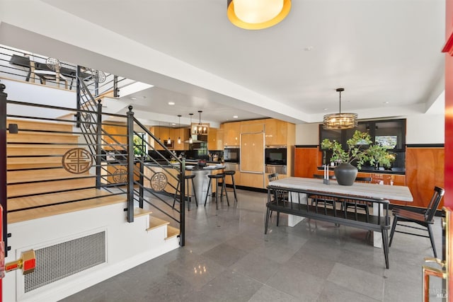 dining area featuring visible vents, recessed lighting, stairs, and a chandelier