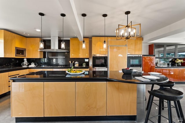 kitchen featuring decorative backsplash, modern cabinets, a spacious island, stainless steel microwave, and wall chimney exhaust hood