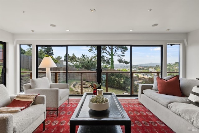 living area featuring recessed lighting and a healthy amount of sunlight