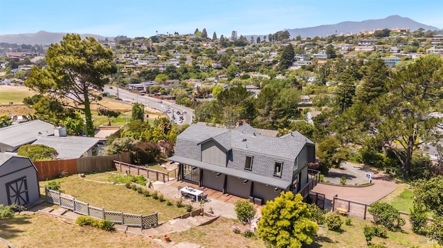 birds eye view of property with a residential view and a mountain view