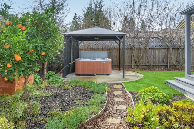 view of yard with a gazebo, a hot tub, and a patio