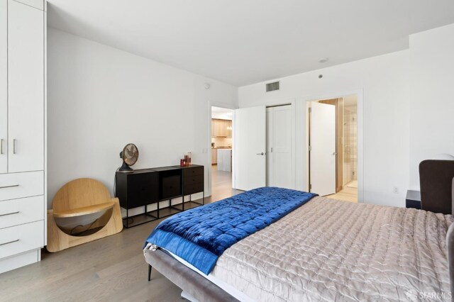333 Beale St Unit 4E, San Francisco, CA 94105 - bedroom with wood finished floors and ensuite bathroom