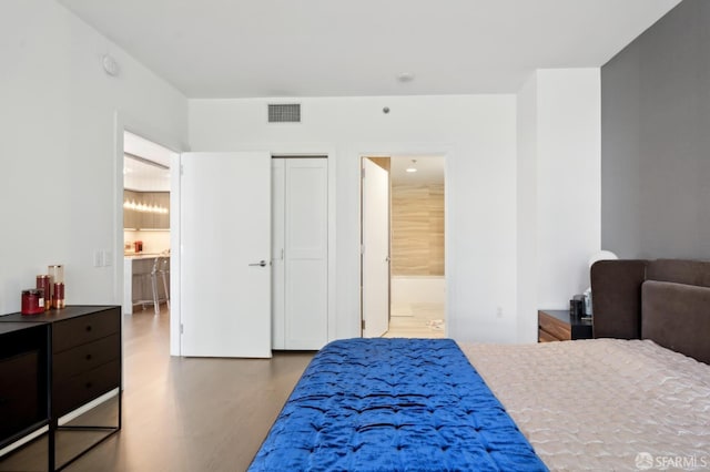 333 Beale St Unit 4E, San Francisco, CA 94105 - bedroom with wood finished floors and ensuite bathroom