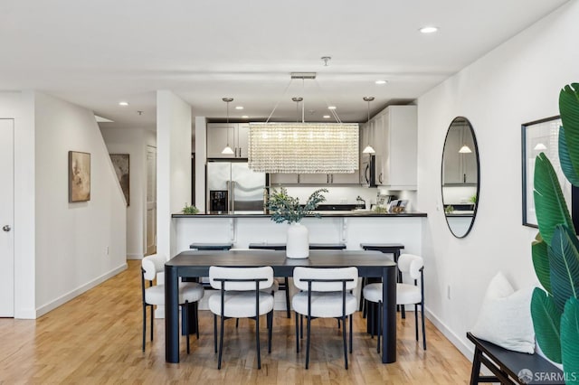 dining space featuring light hardwood / wood-style flooring