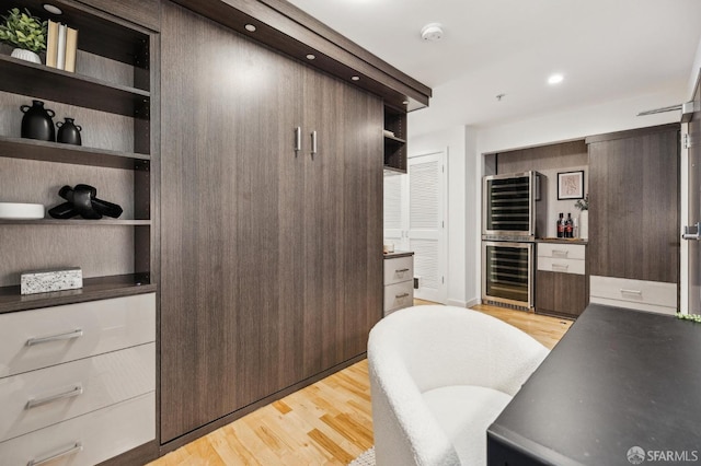 interior space featuring light hardwood / wood-style floors and beverage cooler