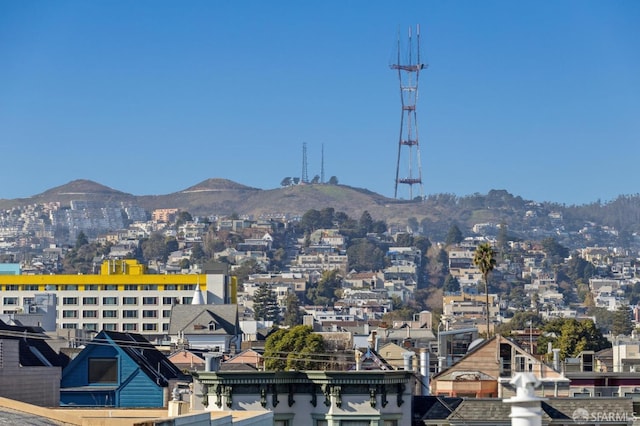 property's view of city with a mountain view