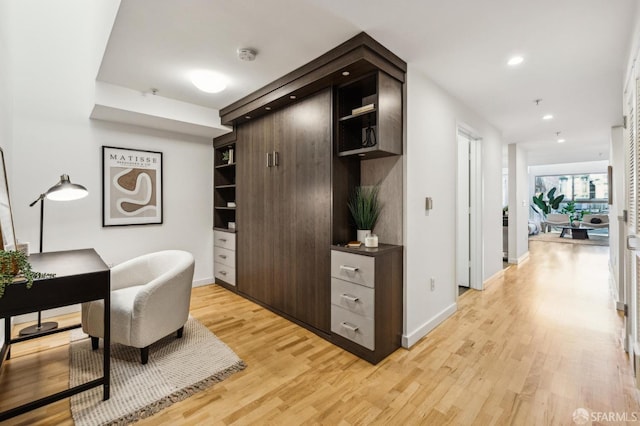 office space with light hardwood / wood-style flooring