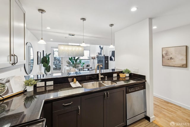 kitchen featuring decorative light fixtures, sink, light wood-type flooring, stainless steel dishwasher, and dark brown cabinets