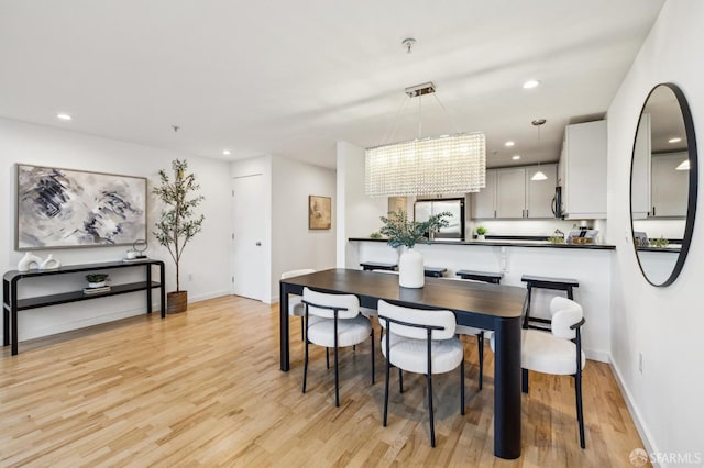 dining area with light hardwood / wood-style flooring