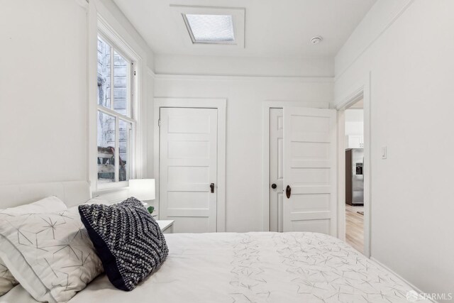 1015 Key Ave, San Francisco, CA 94124 - bedroom featuring a closet and stainless steel fridge with ice dispenser